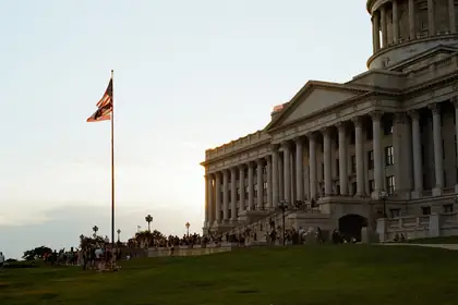 services-03 a-flag-flies-near-a-grand-building-with-columns-p-36utoh-zw